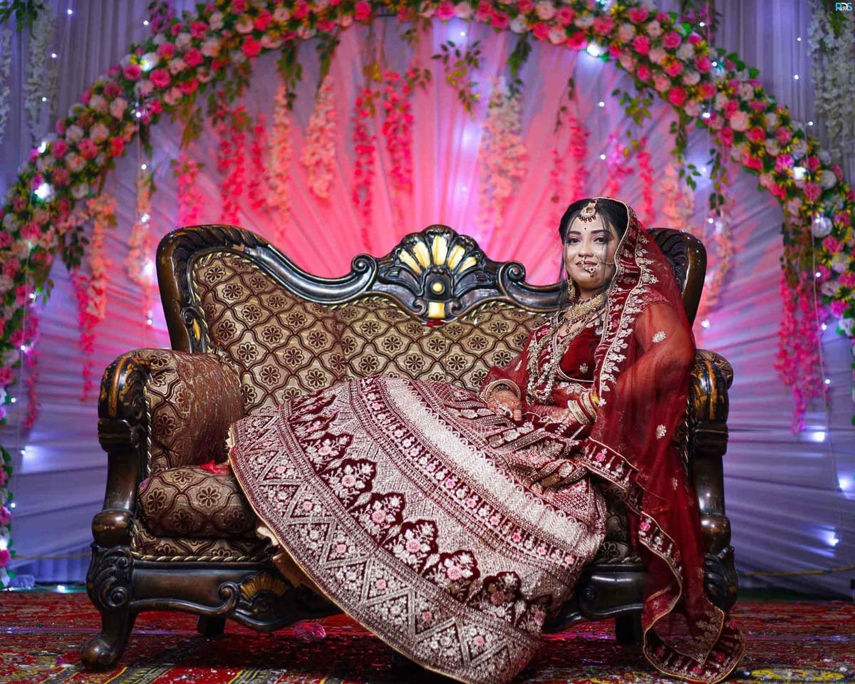 Bride and groom seated together at the reception